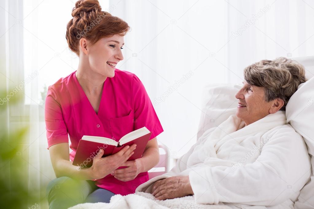 Reading to old woman