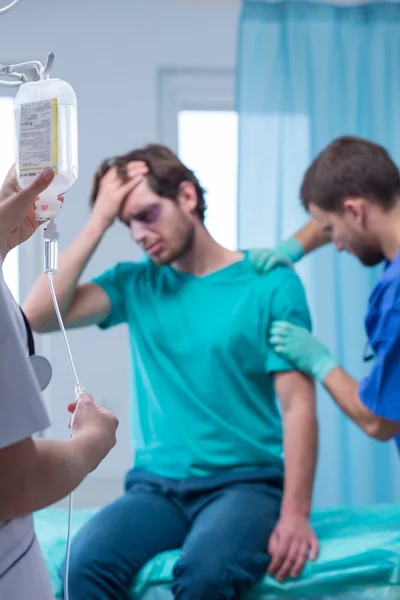 Bruised man with painful arm — Stock Photo, Image