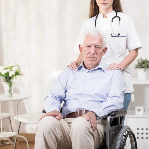 Sad elderly man on wheelchair — Stock Photo, Image