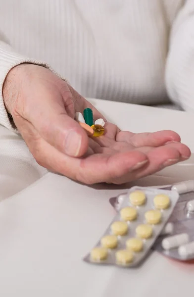 Hand with pills in it — Stock Photo, Image