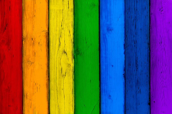 Natural wooden rainbow colored boards. Painted wooden multicolored vertical planks. Abstract textured many-colored background, empty template. Red, orange, yellow, green, blue, violet planks of wood — Stock Photo, Image