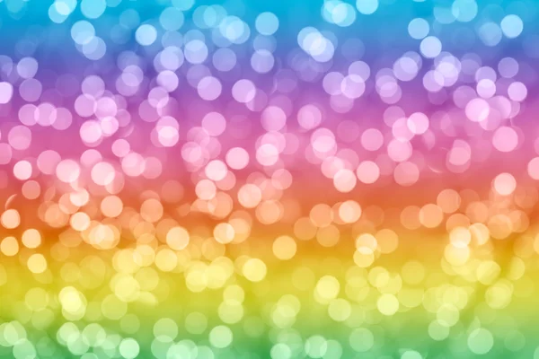 Rainbow colorful background with natural bokeh defocused sparkling lights. Bright and vivid texture with twinkling lights — Stock Photo, Image