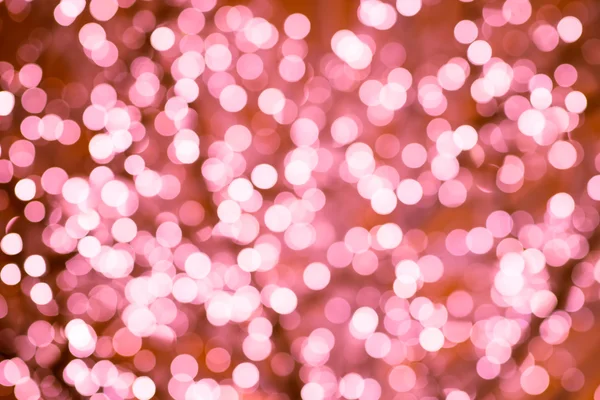 Pink background with natural bokeh defocused sparkling lights. Colorful sakura texture with twinkling lights. Spring colors — Stock Photo, Image