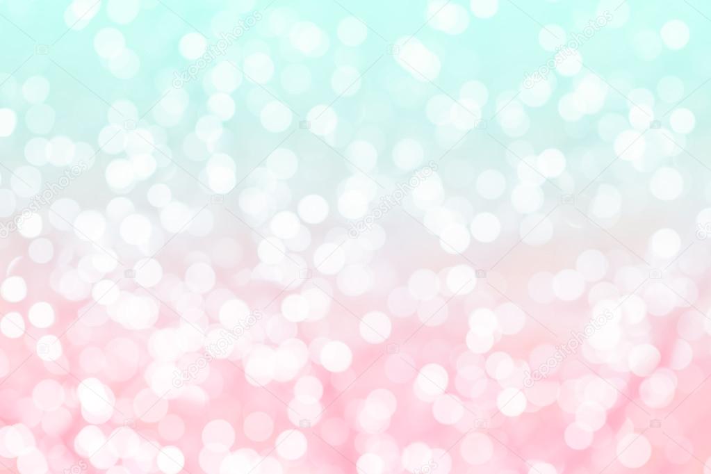 Colorful background with natural bokeh texture and defocused sparkling lights. Turquoise and pink texture with background with twinkling lights. Vintage and pastel colors