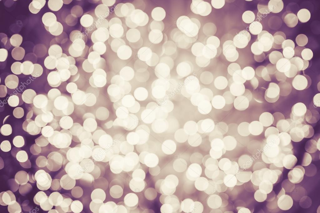 Colorful background with natural bokeh defocused sparkling lights. Vintage texture with twinkling lights. Instagram filters. Retro colors