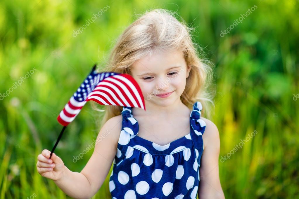 Pretty Pensive Little Girl With Long Curly Blond Hair Holding An