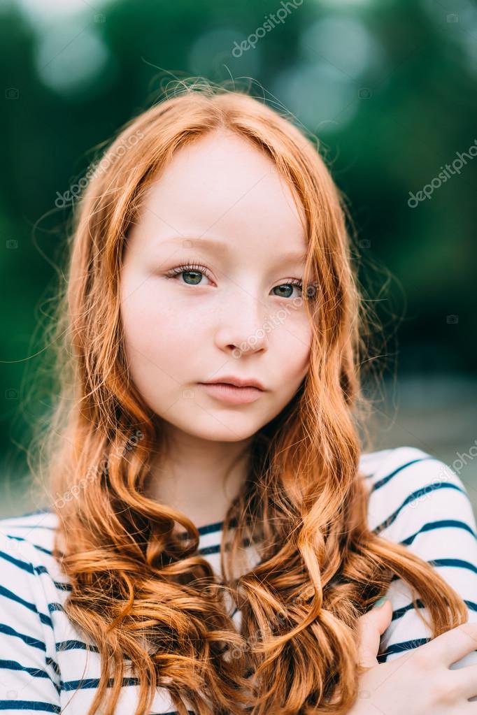 An adorable smiling young woman with green eyes and long An adorable smiling young woman with green eyes and long