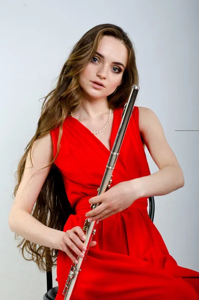 Menina com uma flauta — Fotografia de Stock
