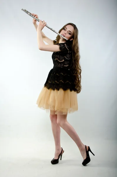 Girl with a flute — Stock Photo, Image