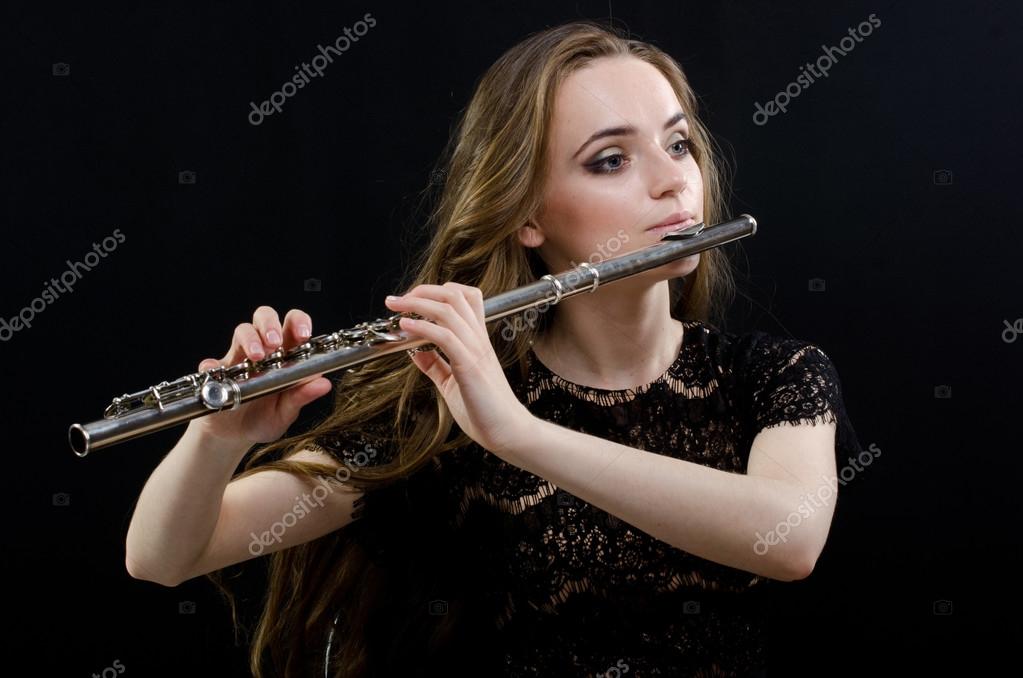 Girl with a flute Stock Photo by ©uminov 112386126