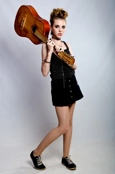 Girl playing the guitar Stock Photo