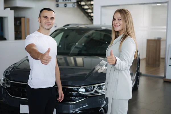 Female sale car for man customer car in car showroom. Good deal