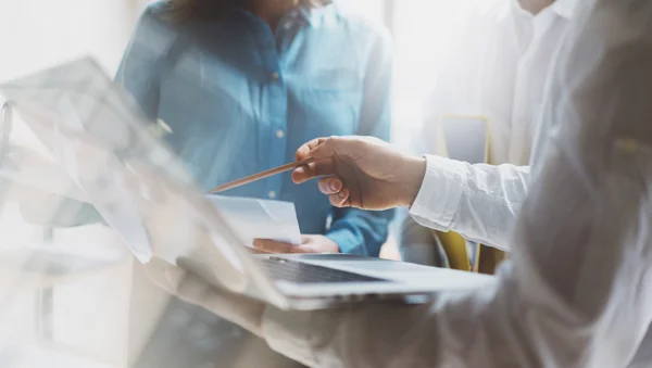 Team work process. Photo young business crew working with new startup project. Project managers meeting. Analyze plans, papers. Blurred background, film effect — Stock Photo, Image