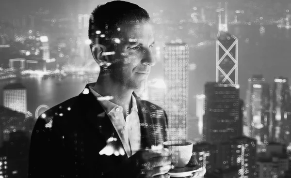 Photo of stylish adult businessman wearing trendy suit and holding cup coffee. Double exposure, panoramic view contemporary city sunset. Horizontal, bokeh, blurred. Black, white — Stock Photo, Image