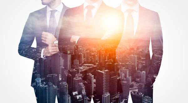 Photo of trio stylish adult businessman wearing trendy suit. Double exposure, panoramic view sunset contemporary city background. Man power, leadership, isolated on white. Horizontal — Stock Photo, Image