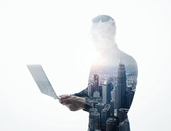 Double exposure bearded businessman wearing black suit and glasses.Banker holding contemporary notebook hands.Work online banking.Isolated white,modern skyscraper city background.Horizontal mockup — Stock Photo, Image