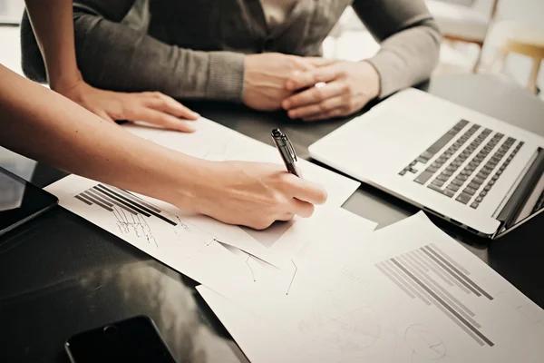 Business situation,meeting of finance department.Photo female hand writing document.Man listening report and using laptop.Working process modern office,discussion startup. Horizontal. Film effect — Stockfoto