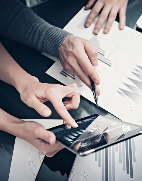 Research department working process.Photo woman showing business reports modern tablet. Statistics graphics screen.Banker holding pen for signs documents,discussion startup idea. Vertical.Film effect — Stock Photo, Image