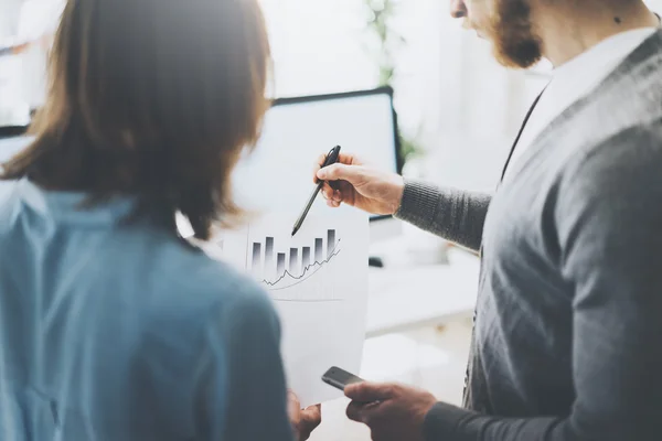 Finance managers meeting,closeup photo papers holding hands. Photo businessmans crew working with new startup project. Idea, analyze marketing plans. Blurred background,light effects, film effect. — Stock Photo, Image