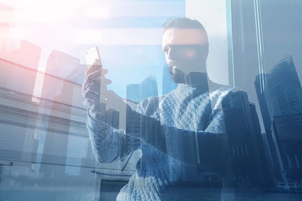 Double exposure image man making photo smartphone.Picture bearded trader manager in modern office panoramic view.Contemporary city skyscrapers background. Film and bokeh effect.Horizontal — Stock Photo, Image