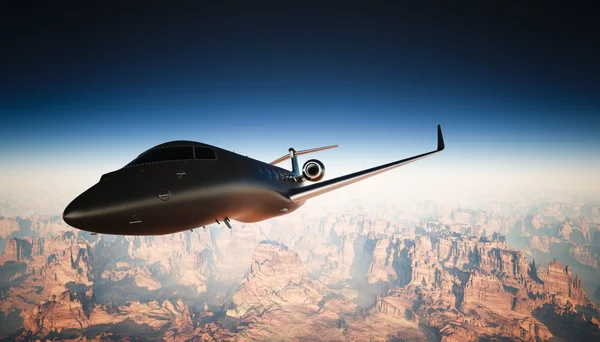 Foto Cabina Black Matte Luxury Generic Design Jet privado Volando en el cielo bajo la superficie de la Tierra. Fondo del Gran Cañón. Viajes de negocios. Vista horizontal del ángulo izquierdo. Efecto de película. Renderizado 3D . — Foto de Stock