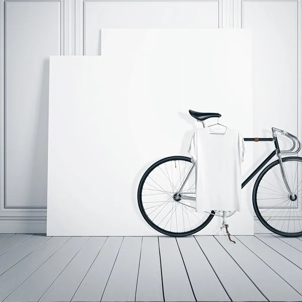 Foto vit rum Interior modern Studio hus med klassisk cykel. Tom canvas på trägolv. blank tshirt hängande cykel. Fyrkantiga utkast. — Stockfoto