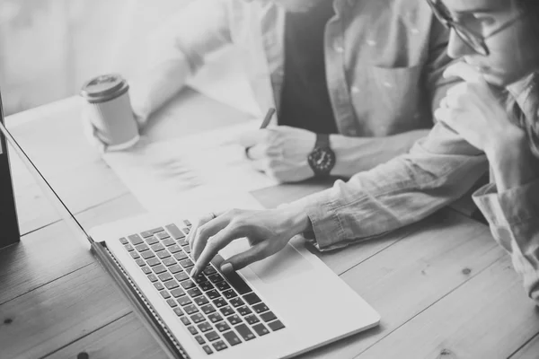 Sales Department Working Modern Design Loft.Woman Showing Market Report Charts Notebook.Marketing managers Planning New Strategy.Researching Process Wood Table.Horizontal.Blurred Background.Black Whit