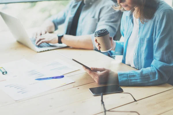 Coworkers team researching process in modern loft.Project managers working.Holding tablet female hand.Young business crew working with new startup office.Risk management process.Blurred,film effect. — Stock Photo, Image