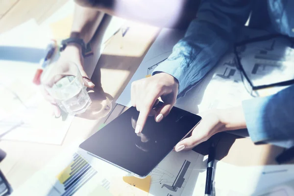 Girl Touching Display Digital Tablet Hand.Reflections Screen.Project Producers Research Process.Young Business Crew Working New Startup Studio.Analyze market stock.Blurred, film effect.Horizontal . — Photo