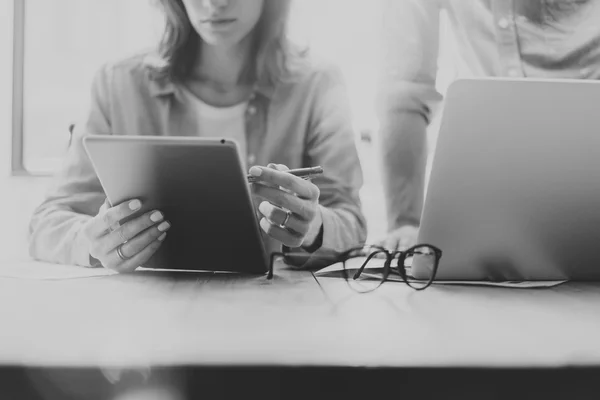 Picture Sales Manager Working Modern Studio.Woman Showing Market Report Digital Tablet.Account Department Work New Startup Project.Researching Process Wood Table.Blurred Background.Black White.