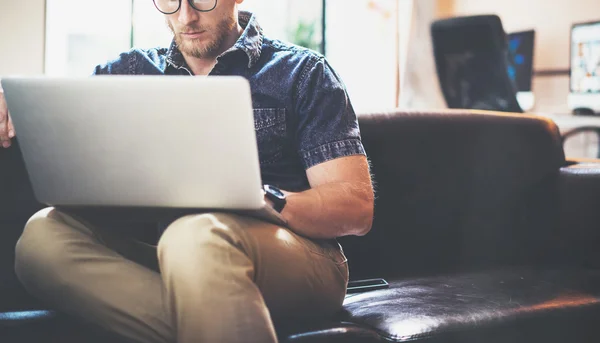 Successful Stockbroker working Laptop modern Interior Design Loft Office.Man work Vintage Sofa,Use contemporary Notebook,Browsing Internet.Blurred Background.Business Startup Idea Process.Horizontal — Stock Photo, Image