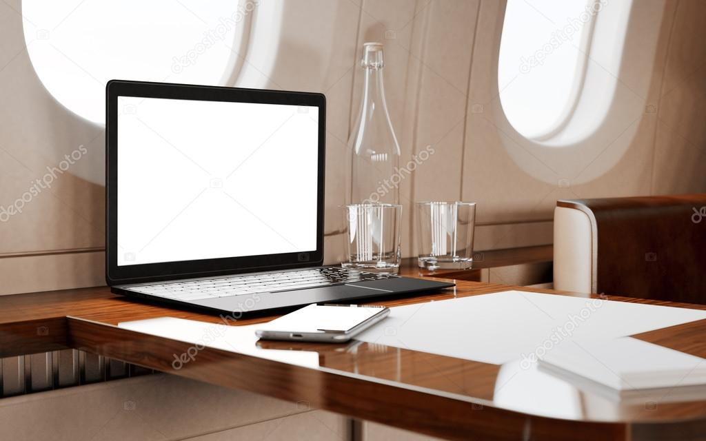 Modern Laptop in Private Airplane