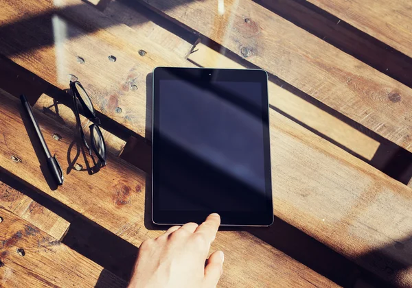 Closeup Mans Hand Touching Home Button Modern Tablet.Black Screen Gadget and Glasses Wood Table Inside Interior Coworking Studio Place.Reflections Natural Background.Horizontal Blurred. — Stock Photo, Image