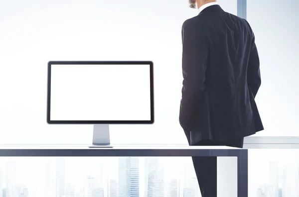 Businessman and computer display — Stock Photo, Image