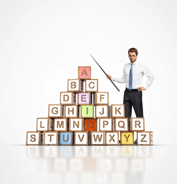 Young teacher and  letter blocks — Stock Photo, Image