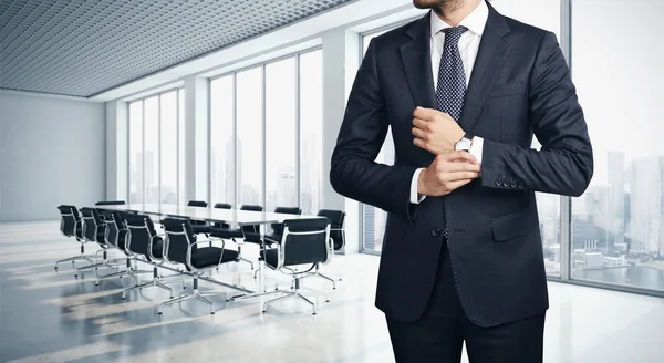 Young businessman and office interior — Stock Photo, Image