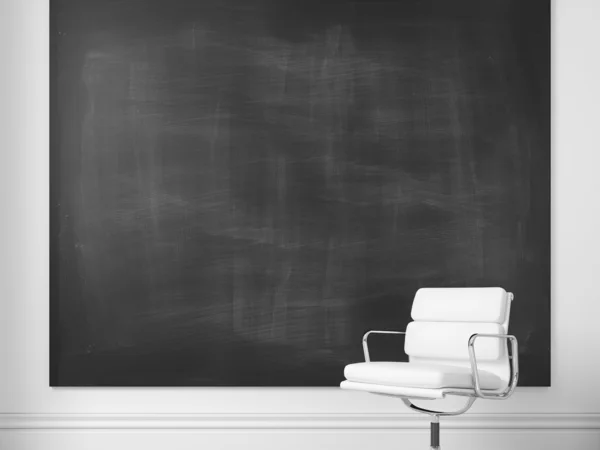 Chair and blank chalkboard on a wall — Stock Photo, Image