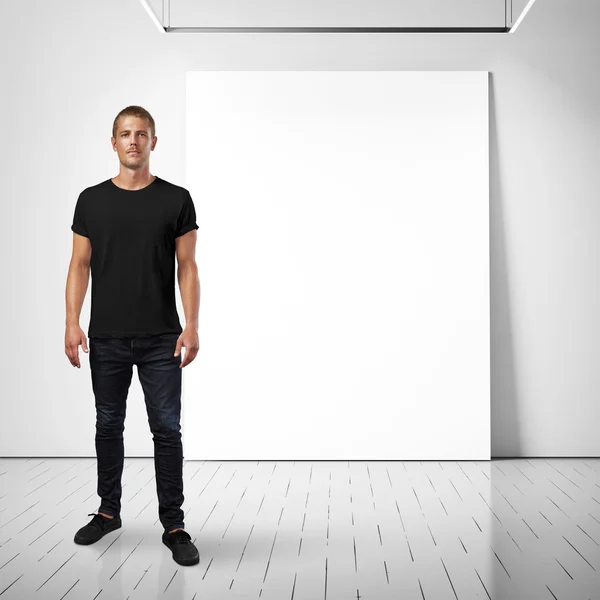 Man and white poster on a wall — Stock Photo, Image