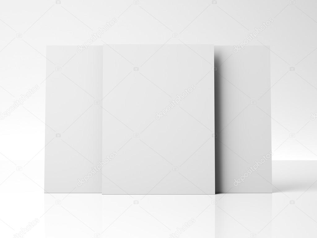 three blank posters on white wall