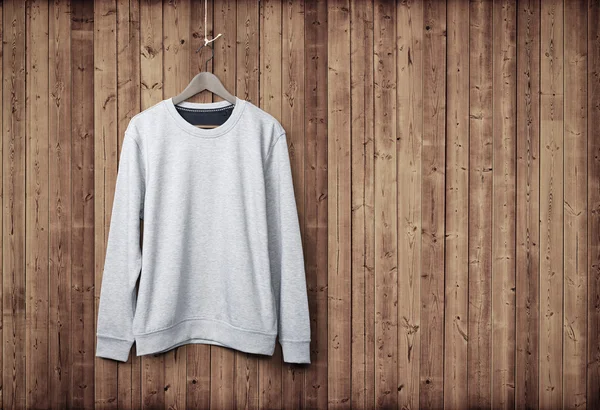 Sweater on wood wall — Stock Photo, Image