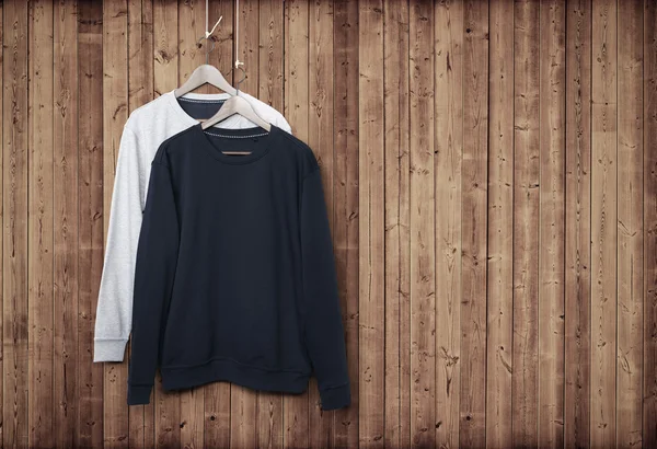 Sweater on wood wall — Stock Photo, Image