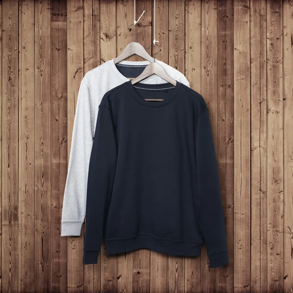 Sweater on wood wall — Stock Photo, Image