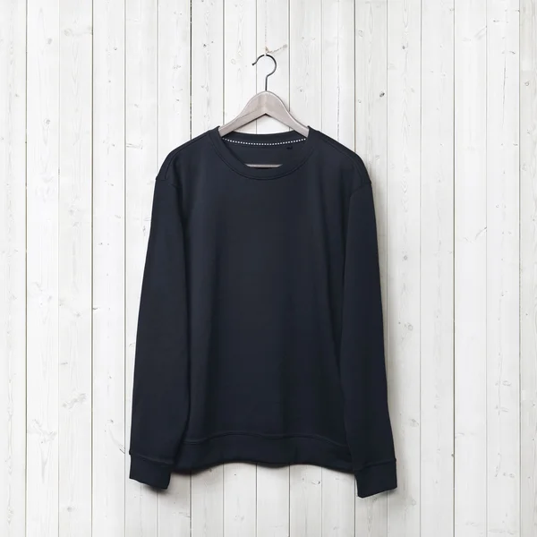 Sweater on white wall — Stock Photo, Image