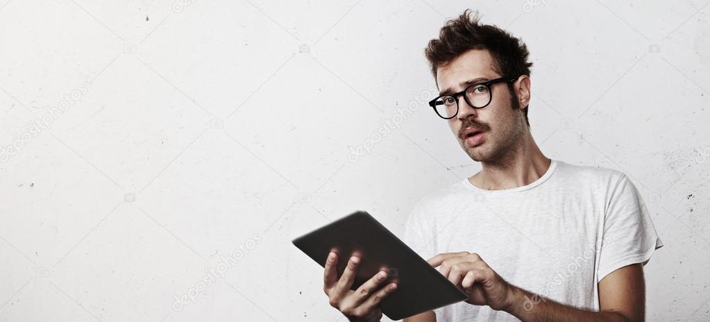 Young man with digital tablet in his hands