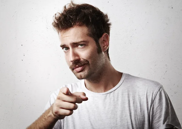 Young man pointing towards the camera — Stock Photo, Image