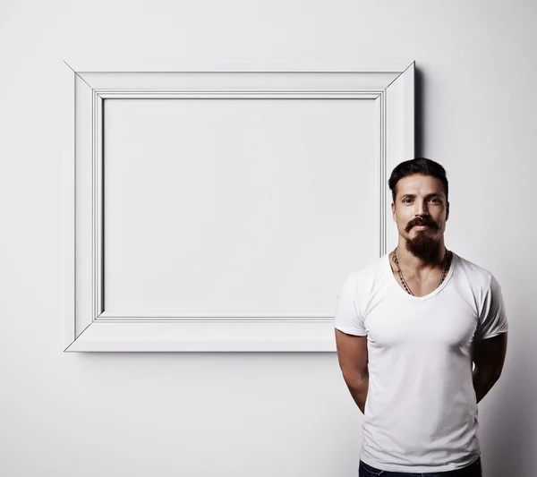 Bearded guy with photo frame — Stock Photo, Image