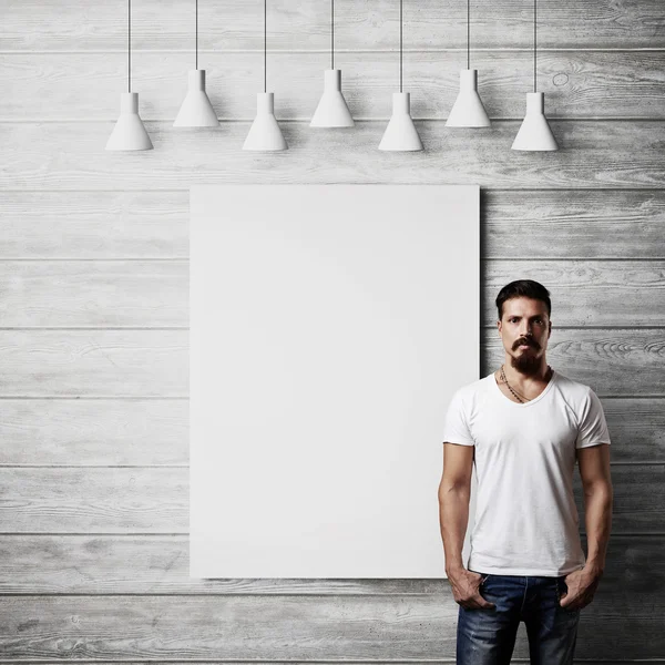 Bearded guy with blank poster — Stock Photo, Image