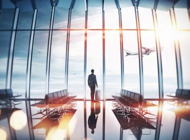 Businessman at airport near the window