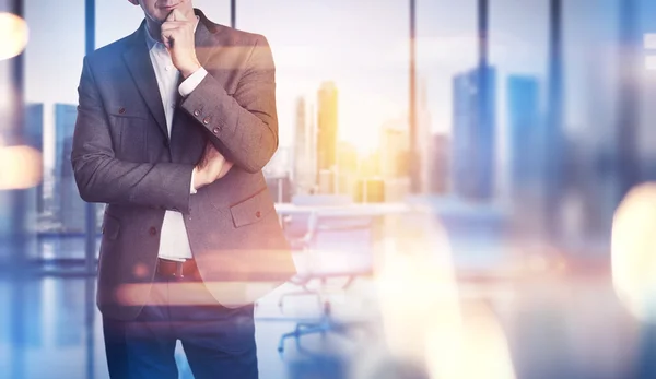 Businessman on the office background — Stock Photo, Image