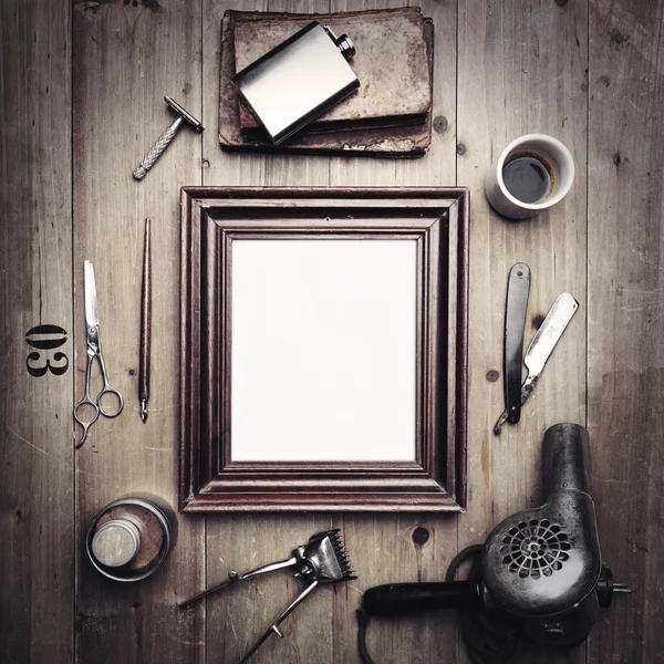 Tools of a barber with old picture frame — Stock Photo, Image